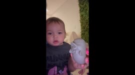 Baby Imitates Dolphin's Beak