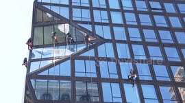USA: Window washers clean high rise building in New York