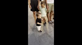 Street Violinist Enchants Young Boy