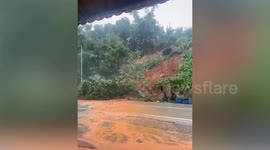 Mountain landslide blocks road outside school stranding teachers