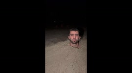 Group bury themselves in sand and sing 'SpongeBob' in Milano Marittima, Italy