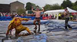 Hundreds of revellers watch ‘world gravy wrestling championships' at pub garden
