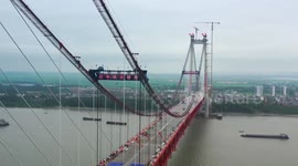 China's 1st double-deck cable-stayed suspension bridge completes closure over Yangtze River