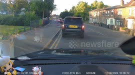 Range Rover drives around and through temp traffic lights