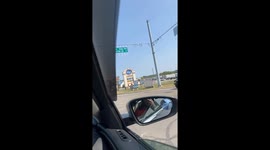 Caped Crusader Dances on Top of Car