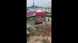 Man falls out of homemade 'rescue boat' while helping out a friend