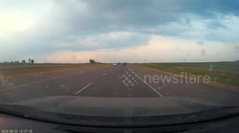 Lightning bolt strikes road close to vehicles in dash cam video from Calgary, Alberta