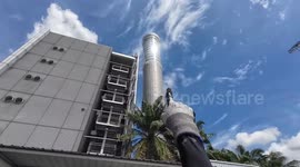 Workers change light bulbs on one of world's tallest aviation radio tower