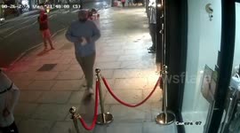 Moment brazen 'thief' distracts diners with paper as he 'swipes phone'