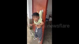 China: The Boy Hanging on the Door