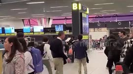 Furious hammer-wielding passenger smashes airport check-in desk in Chile