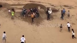 Children buried in dune rescued by holidaymakers after making cave in sand