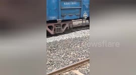 A tribal Indian Woman in Telangana comes under moving train, escapes unhurt