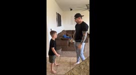 Little boy accidentally slaps himself after falling for dad’s high five trick