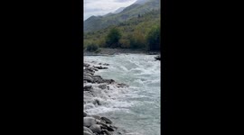 Screams of joy and fear echo as thrill seekers conquer the river rapids