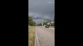 Calgary, Canada: Floodwater flows through street following INTENSE hailstorm