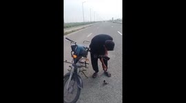Motorcyclist helps bird, gets hit and falls