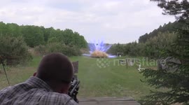 Parents reveal gender of baby to friends and family with a sniper rifle