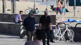 Tom Jones and his son Mark Woodward are spotted out for a walk along the beach in Santa Monica, Ca