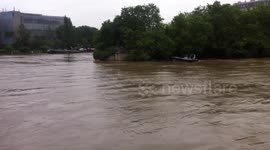 Man falls into the swollen River Seine, France