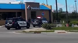 Half-naked man tries to 'flee police' outside Domino's Pizza restaurant