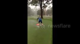 Skimboarding on a golf course during Sydney storm