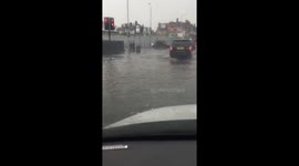 UK motorists battle through deep floodwater after heavy rainstorm