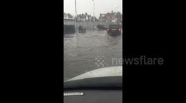UK motorists battle through deep floodwater after heavy rainstorm