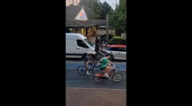 A Penny Farthing rider - one of hundreds taking part in mass cycling event reclaim the road in SW London