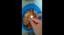 Toddler blows birthday 'cake' made of sunny side up eggs and rice