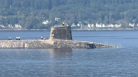 UK submarine heading home after deployment doing transfer on Loch Long in Argyll Scotland