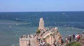 China: Seagulls Fly in The Sky As Tourists Visit the Chengshantou Scenic Area in Rongcheng