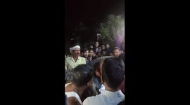 Villagers catch crocodile and parade it through streets