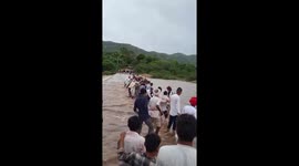Locals form human chain to save goats from floods
