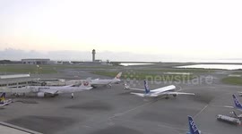 Boeing 777 spews smoke at airport in Japan