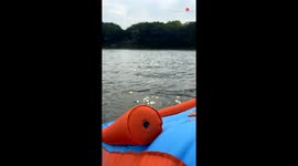 Mom takes an unexpected dive into water while testing new 'Pontoon Slide' for kids