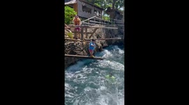 Fearless toddler leaps from diving board into choppy sea