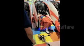 Terrifying moment Chinese woman's hair gets caught in massage chair