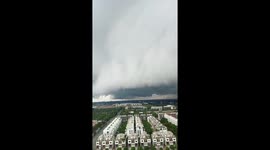 Ominous storm cloud rolls towards city in Vietnam