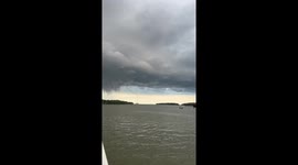 Waterspout tornado forms right angle as it churns through sea
