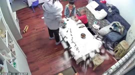 Child breaks glass table with screwdriver in China