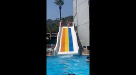 Boy finds out he stands no chance on water slide without epic fail