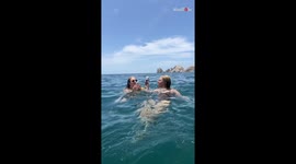 Girl rushes to save her phone after it unexpectedly falls into the river