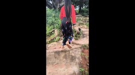 Snake bites woman's FOOT as she walks through park
