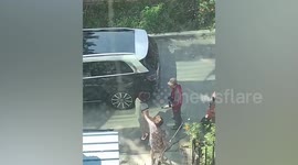 Angry Chinese woman's karate kick at food courier ends in tears