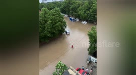 Brave Delivery man wades through flooded street to take meal to residents in Ahmedabad, Gujarat