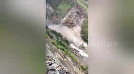 Land crumbles on mountainside and slips down in India