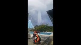 Waterspout tornado tears across sky above homes in the Philippines