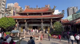 Worshippers visit the Longshan Temple in Taipei, Taiwan