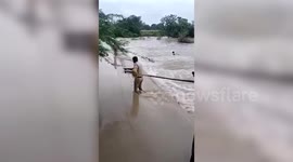 Heroic rescue: Officials save man from drowning in floodwaters in southern India